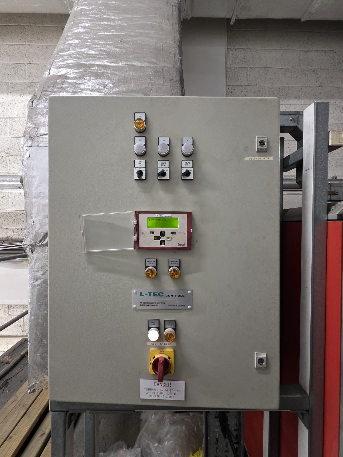 TAC Xenta 301 AHU control panel with operator display showing live temperature readings after repair